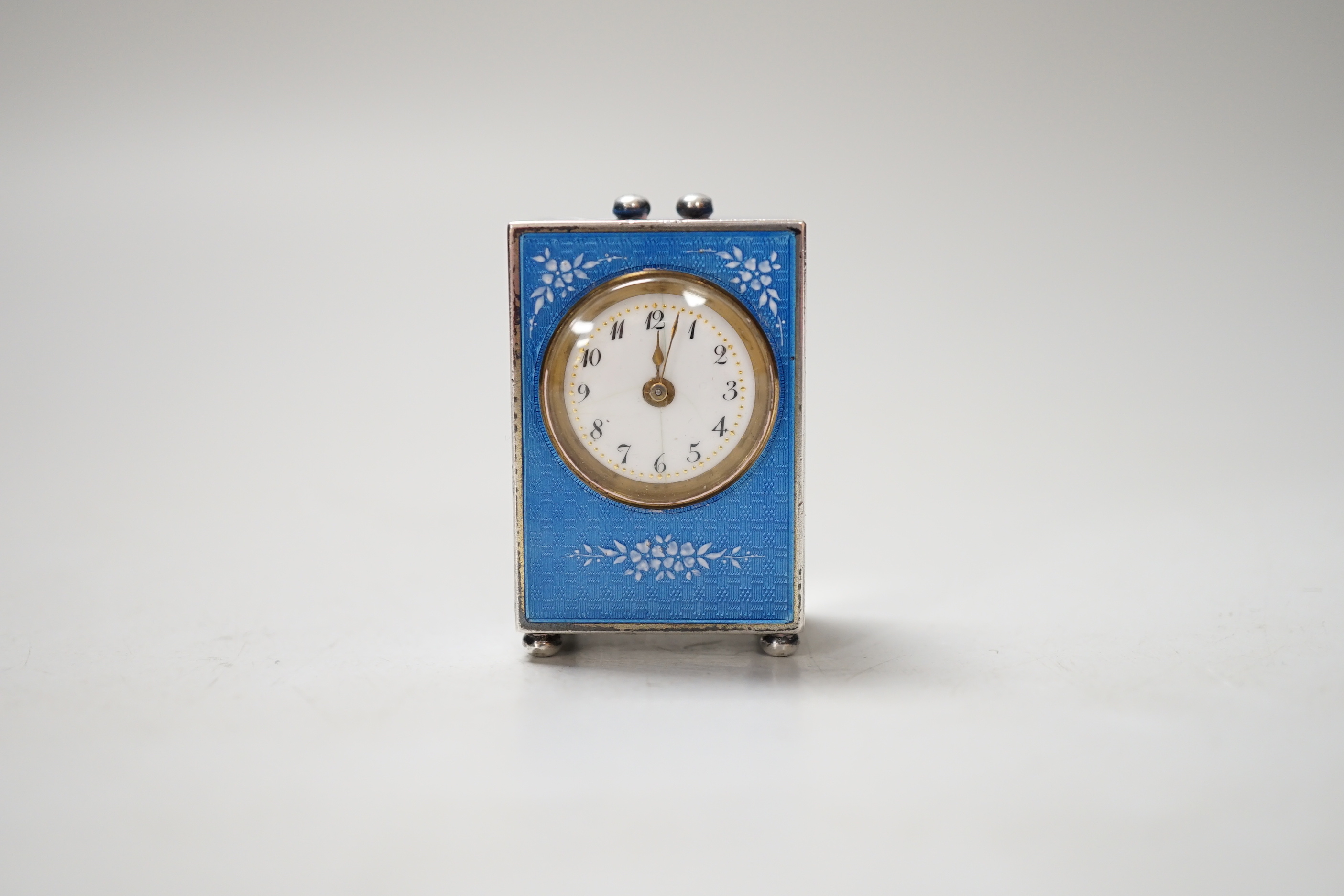 A 20th century Continental 935 standard blue enamelled white metal miniature timepiece, with mechanical movement, 4.5cm, lacks handle